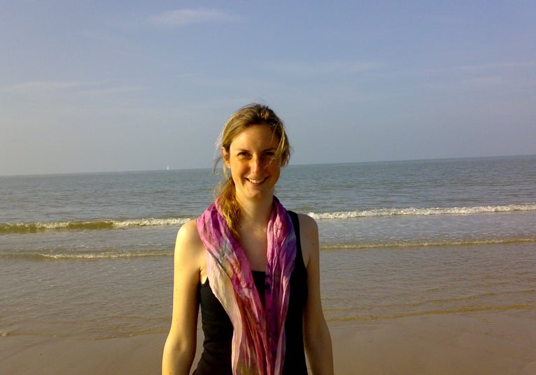 Friendly smiling woman at the beach