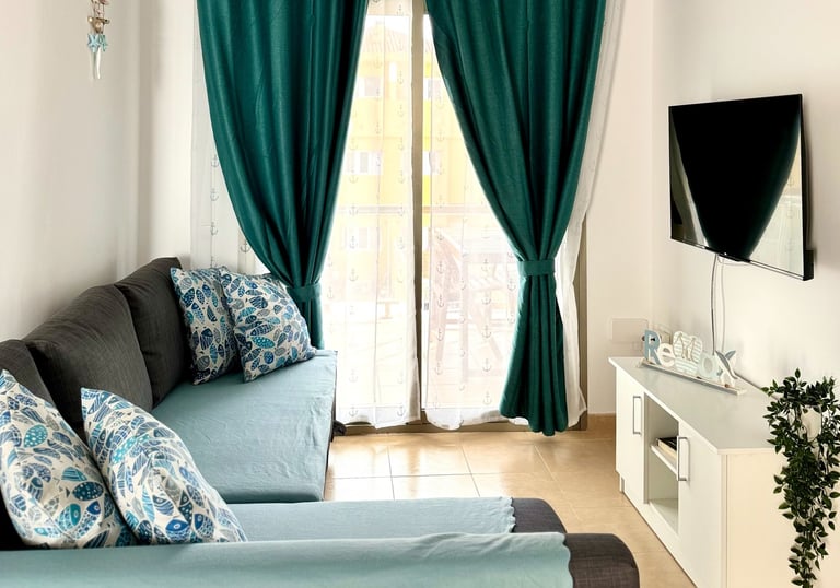 a living room with a couch and a television