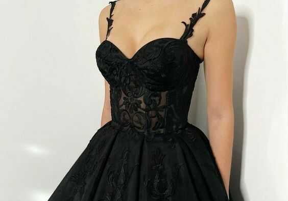 a woman in a black dress with a black dress