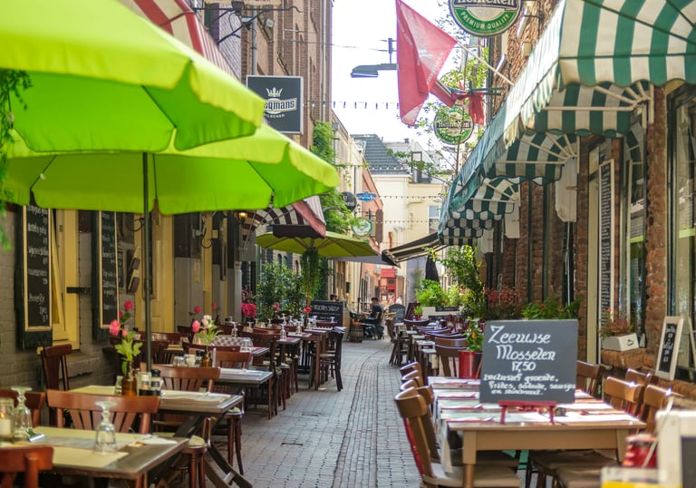 A welcoming street of Arnhem, with restaurants, bars, and shops for exploring