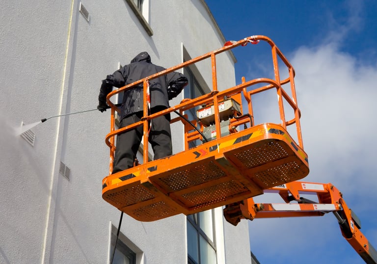 cleaning and pressure washing on a lift in fort myers