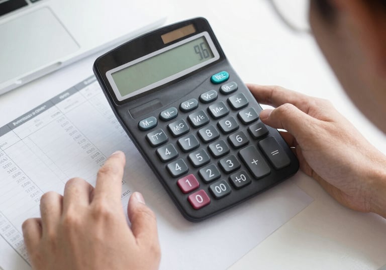 Close-up of hexagonal screws and wood screws neatly arranged on a clean white surface.