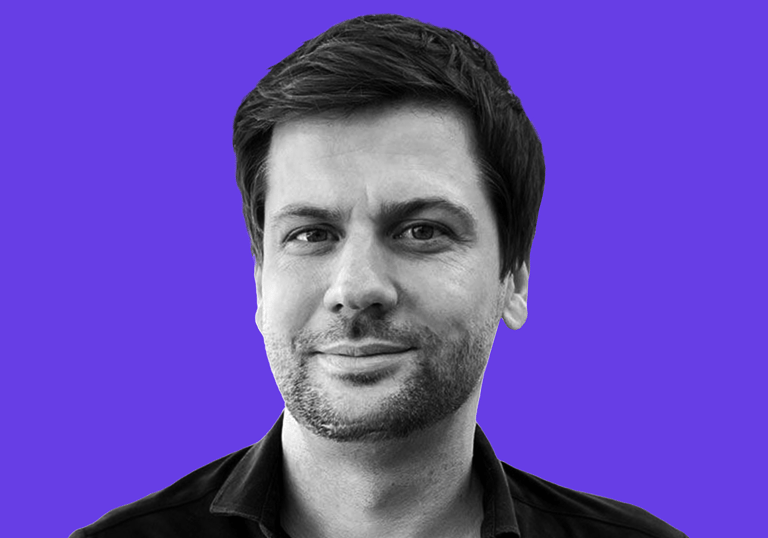 Black and white portrait of Jochen Dominik Berger on a vibrant purple background.