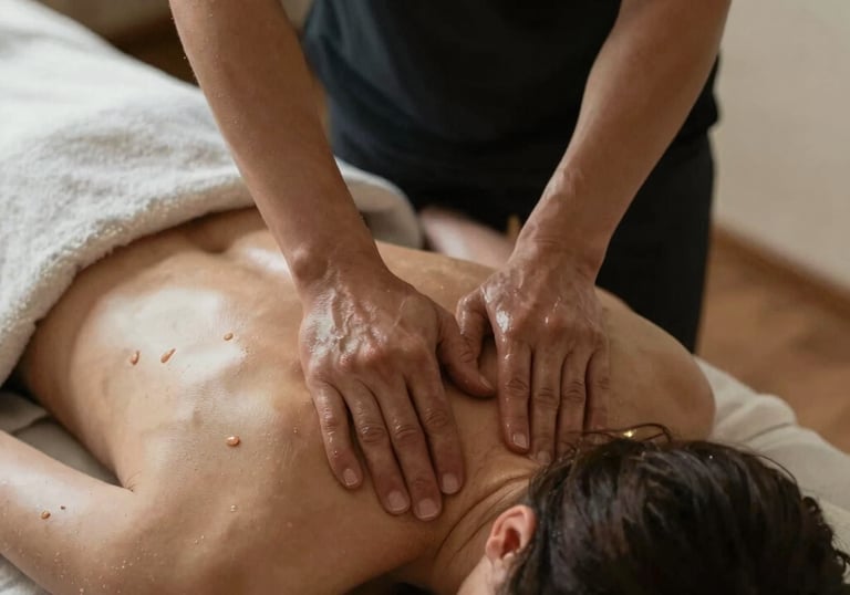 Professional massage therapist performing a Swedish back massage for a woman at Zen Massage Therapy
