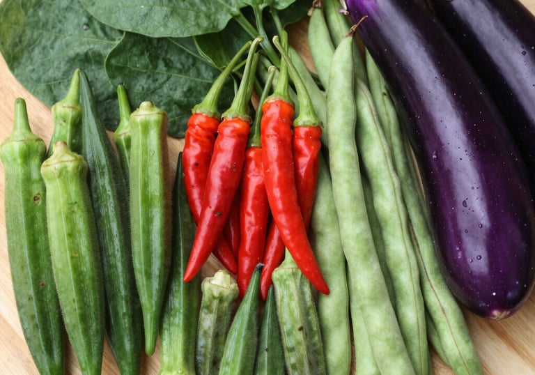 Colorful display of fresh vegetables and fruits at the supermarket.
