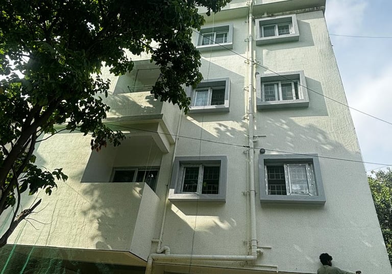 Close-up of a sturdy safety net installed on an apartment balcony in Pune.