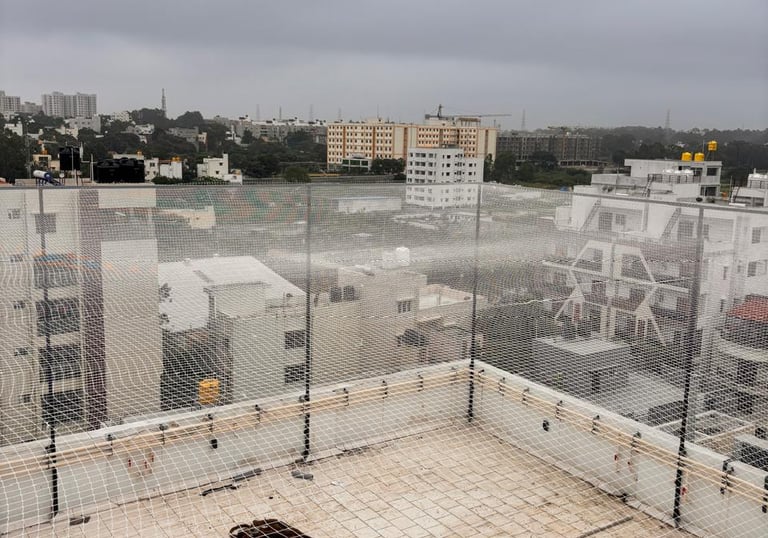 Wide shot of a cricket net enclosure set up in a Chennai sports ground.
