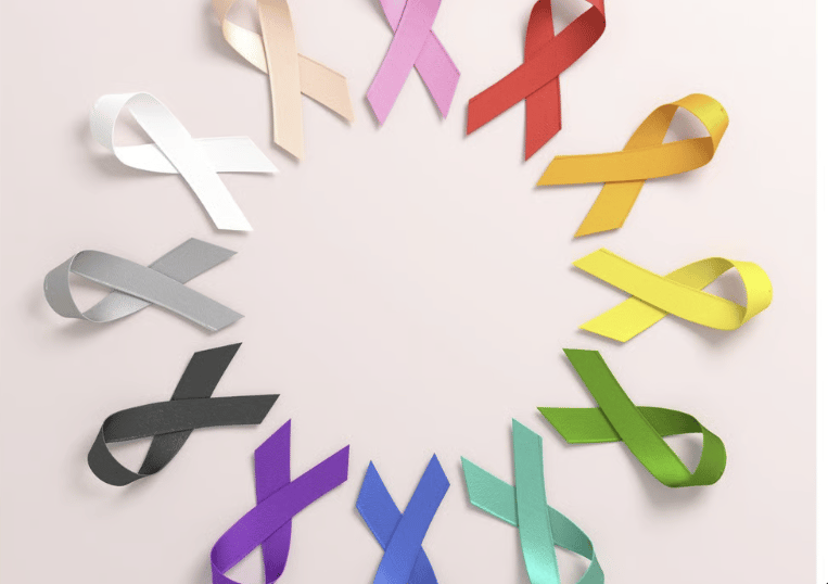 A circular arrangement of colorful cancer awareness ribbons representing various health causes and support.