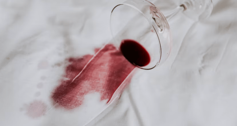 A red wine stain on a white fabric 