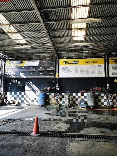 a garage with a checkered floor and a checkered floor