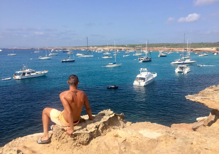 Francesco Margaretini overlooking sea with luxury boats on holiday 