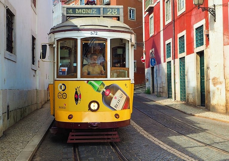 a trolley car on a trolley in a narrow street
