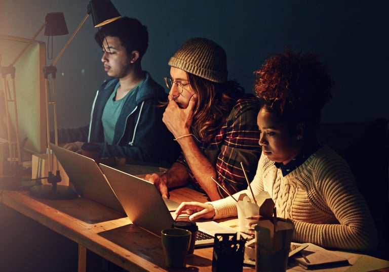 A diverse team working remotely on a digital-first web design platform, reflecting expansion beyond