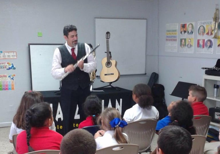 Maestro Bobby Ramirez teaching kids about the flute