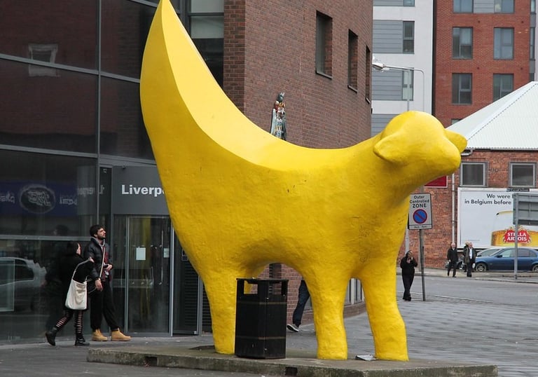 a large yellow banana banana peely dog statue