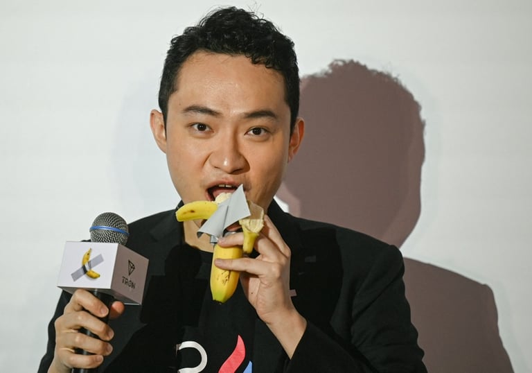 a man in a suit and tie is holding a banana peeler