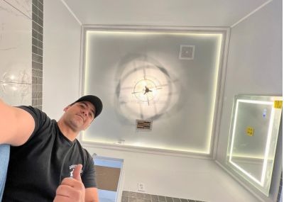 A uniformed Josue David Home Solution technician performing handyman services in Chattanooga, TN.