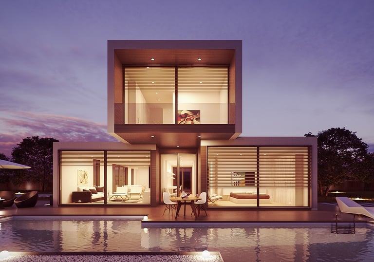 A unique modular vacation rental with a pool, a sunset in the background.