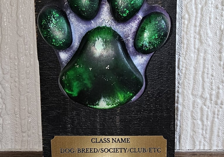 Resin dog show trophy on hardwood base with 3 lines of engraving