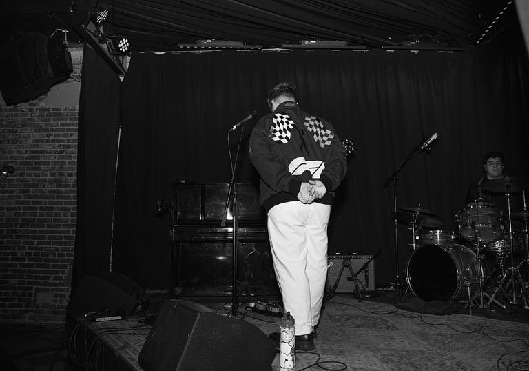 zachary booth on stage at the hotel cafe