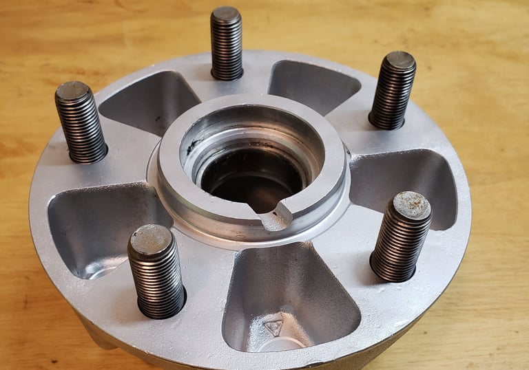 Wheel hubs after vapor blasting. Our vaporhone service will make your restoration look new again.