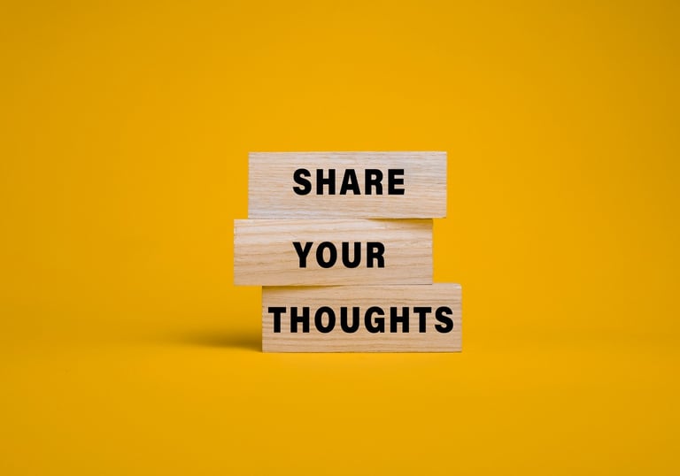 a wooden block with the words share your thoughts