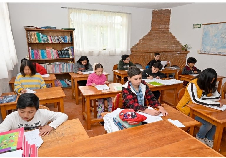 a group of children in a classroom in the Muslim School
