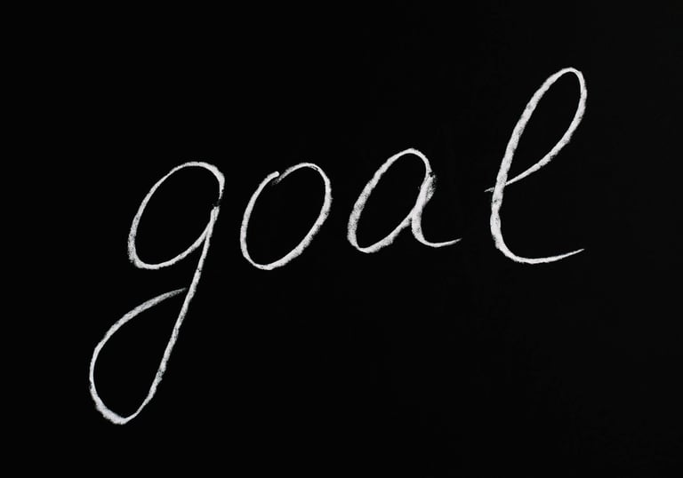 le mot goal sur fond noir pour atteindre des objectifs