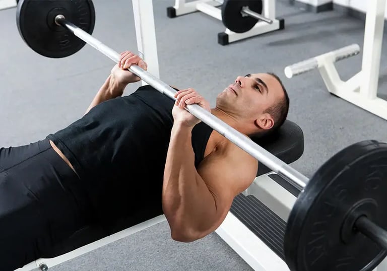 a man is doing a barbell exercise on a bench, close grip bench press