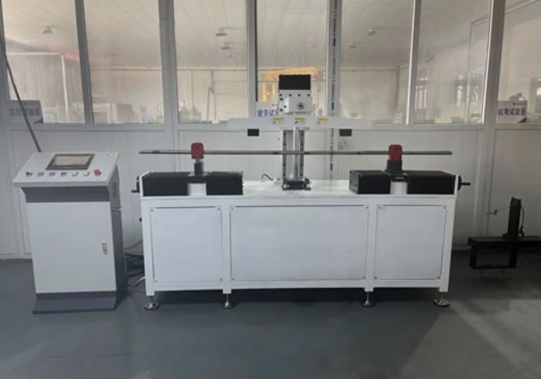 Tensile strength testing performed on barbell shafts for load performance