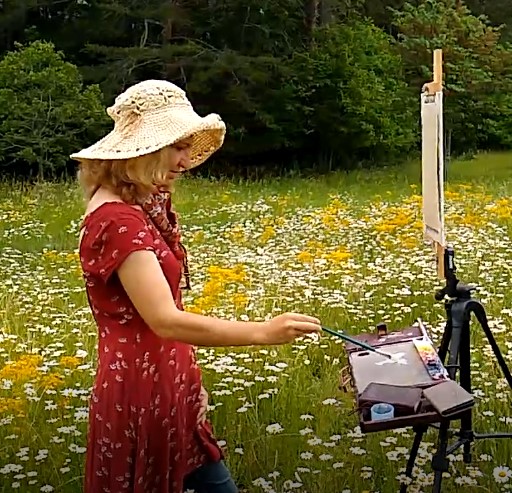 Live wedding painter working on a painting, commissioned by the bride and groom, wedding planner.