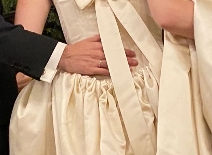a man and woman in wedding dresses and tuxedos
