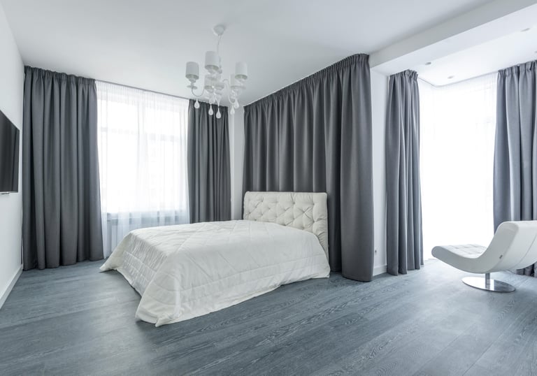 Interior stylist presenting premium curtain fabrics to client