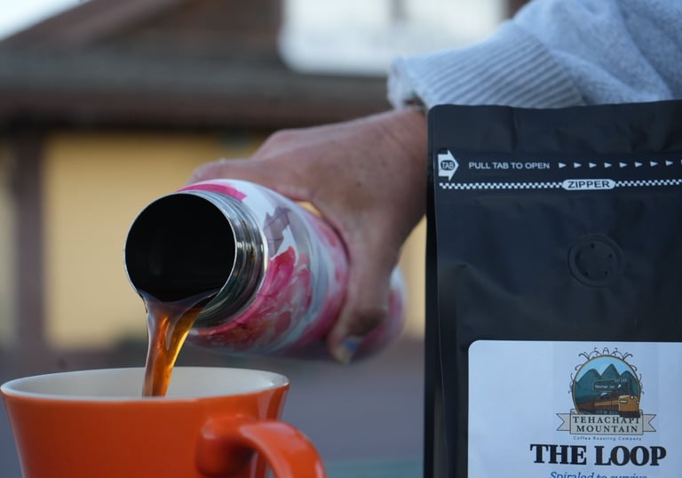 Coffee being poured from a carafe into a cup for the LOOP Roast by TM Coffee Roasting