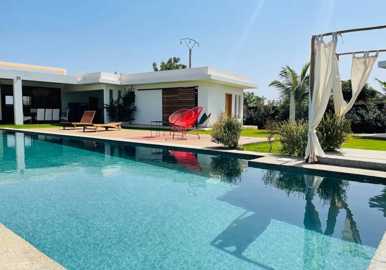 a pool with a red chair and a red chair
