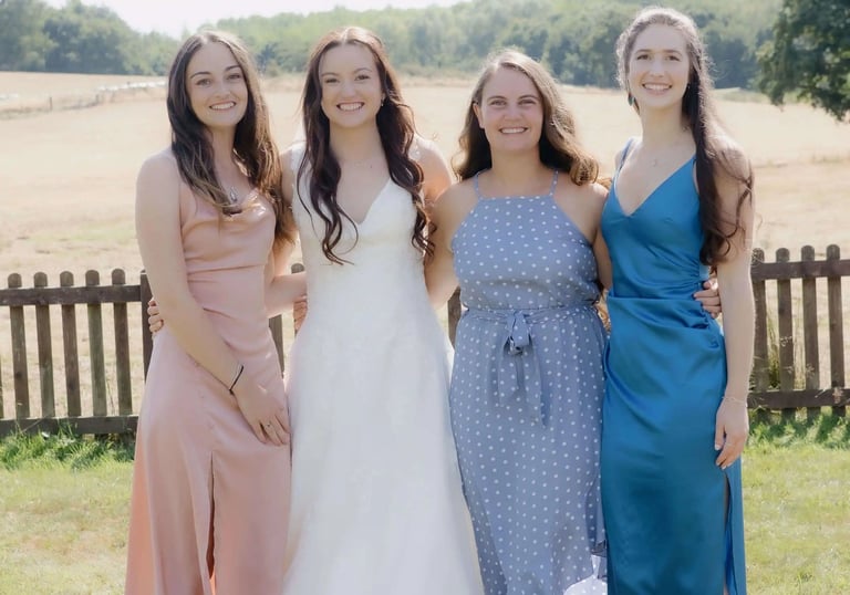 Bride photographed with her friends at a UK summer wedding