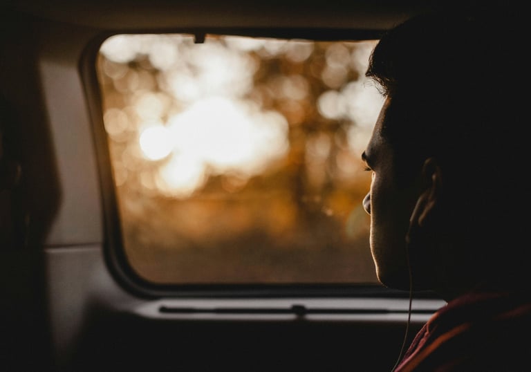 Man is looking through car window
