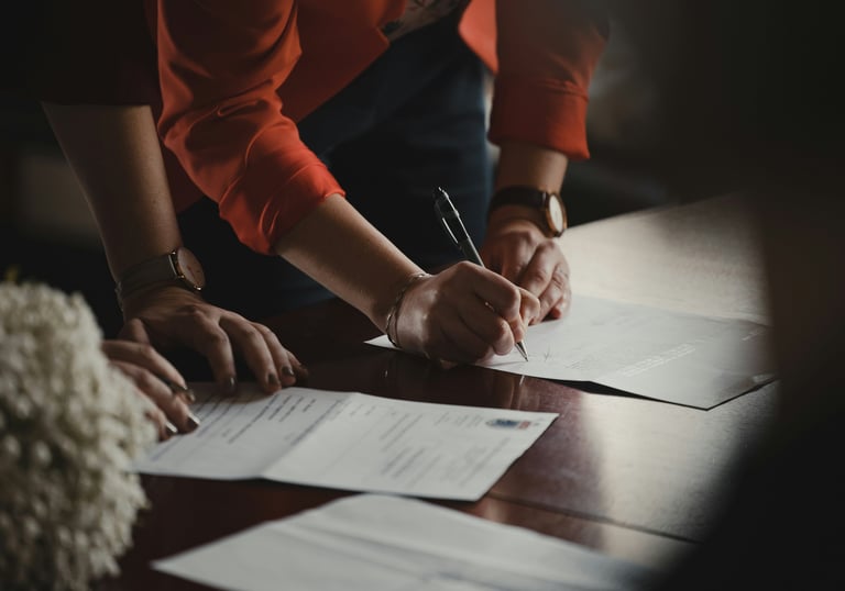 People signing documents
