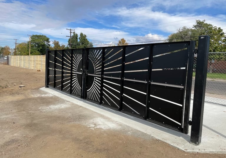 Decorative lot entrance gate with sun pattern