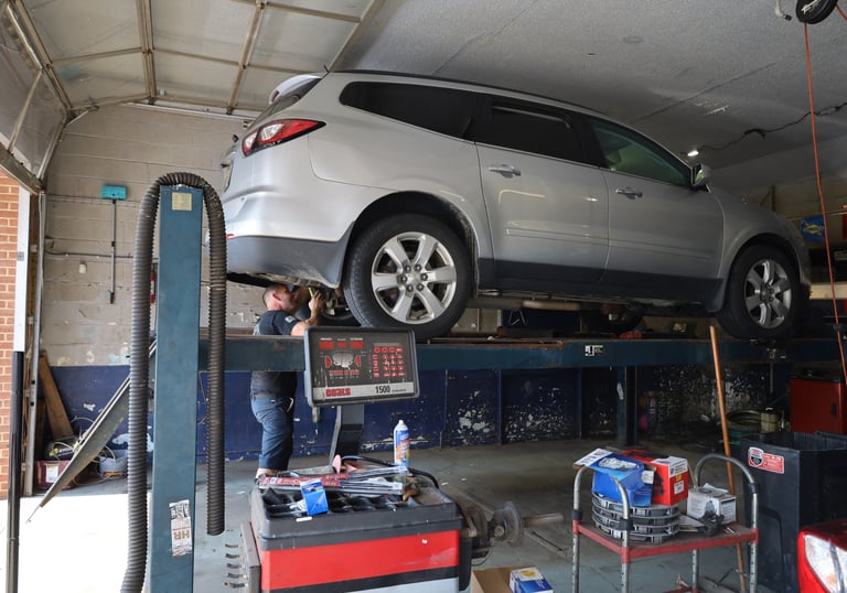 Savios inspecting a vehicle for a customer