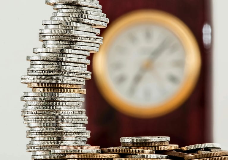 a stack of coins sitting on top of a pile of coins