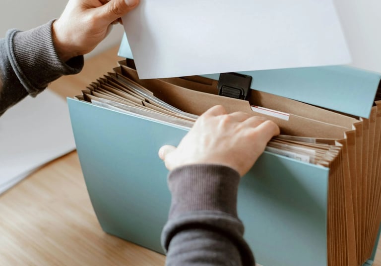 a person holding a piece of paper in a box