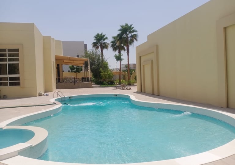 a pool with a swimming pool and a lounge area