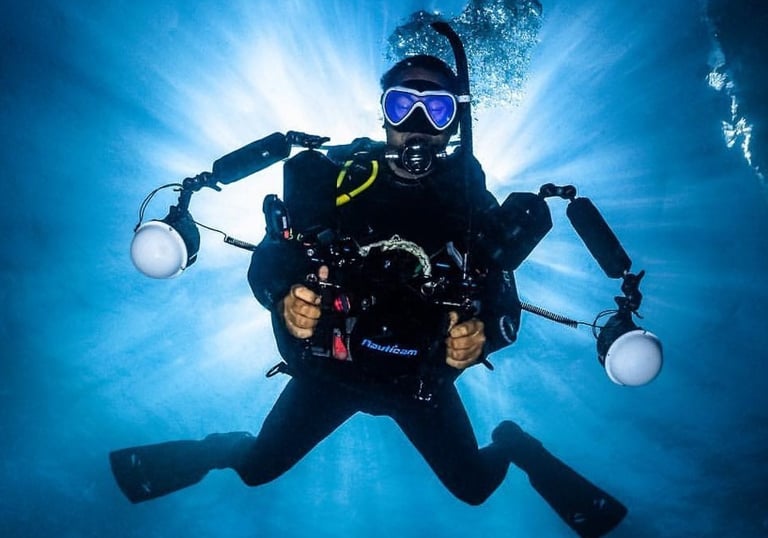 Professional underwater photographer with a Nauticam camera rig during a PADI Digital Underwater Pho