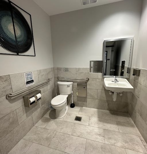 <img src="bathroom-remodel.jpg" alt="Modern commercial bathroom renovation with new tile flooring and fixtures by Retail Work