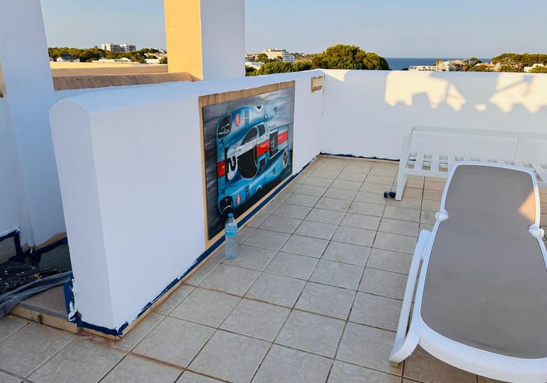 a patio with a lounge chair and a table