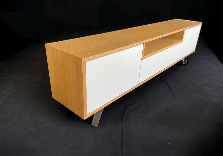 a modern entertainment center with a white cabinet and a wooden entertainment center