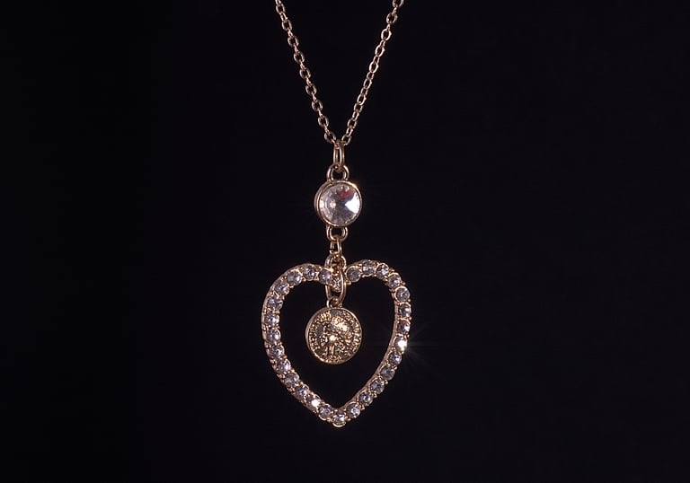 professional jewelry / jewellery photography necklace on a dark background,
