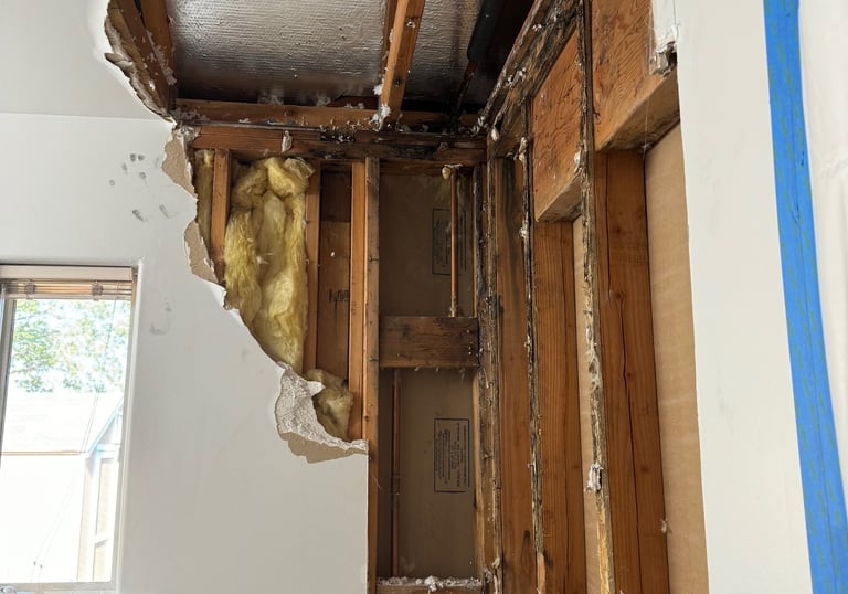 hot water pipe leaked in to bathroom ceiling down the wall