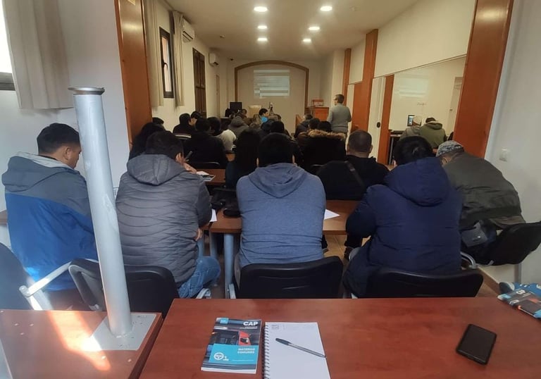 a group of people sitting at a table with papers and papers